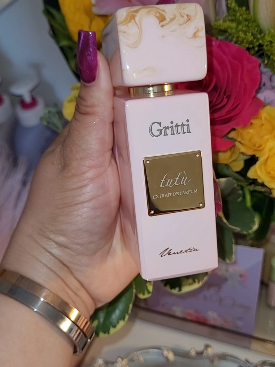 Not new fragrances but a new to me fragrance house @grittifragrances  I have been wanting to try more niche fragrances and happened upon Gritti. The first thing that caught my eye is there packaging and presentation which is top tier. I love pretty packaging😍 This is the first of 2 Gritti fragrances I got for Mother's Day.  Tutu is sweet, soft and feminine. She is real cute! Definite pretty ballerina vibes.🩰 The fruity notes shine through front and center with the softness of vanilla and musk in the background. I am a fruity and gourmand girl so I love how the floral notes play nice and are subtle.  I give this a good 6-8+ hour wear rating (overnight wear test).  Overall this is a super soft fruity and beautiful fragrance with a pretty pink bottle to match. This fragrance made it to my top 5 easy. Don't think about it get it!!!🎀 Top notes are Coconut, Apple, Grapefruit and Cassis; middle notes are Heliotrope, Jasmine and Rose; base notes are Raspberry, Musk, Vanilla and Amber.  #perfumereview #fragrancetiktok #perfumetok #fy  #fragranceunboxing #italianperfume #perfumeunboxing #sotd #pink #grittifragrances #grittitutu #nicheperfume #fruityfragrance #gourmand #vanilla