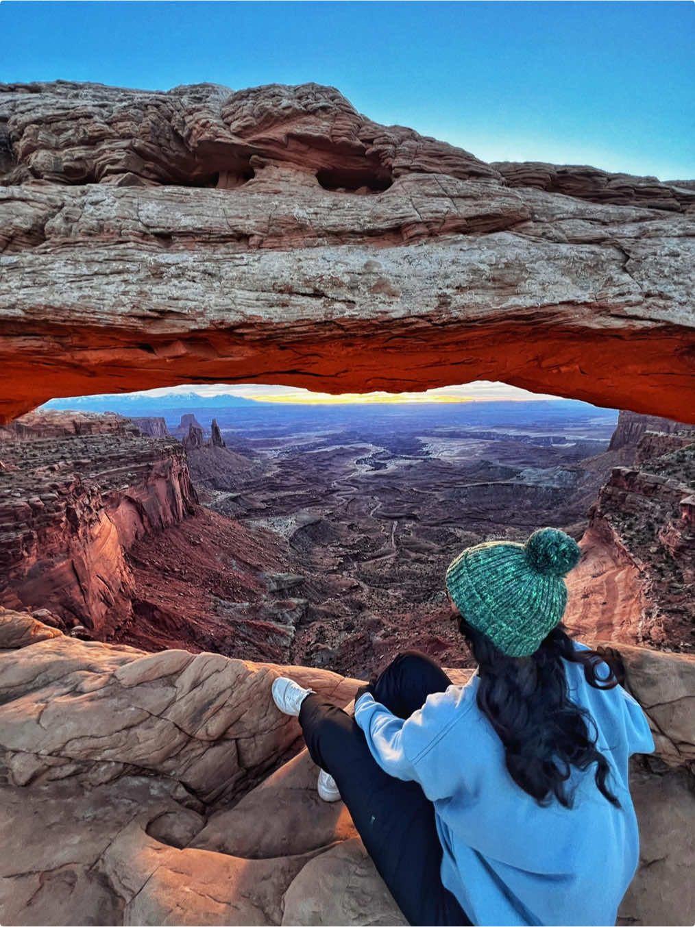 Mesa Arch Trail in Canyonlands National Park. Moab, Utah.  it only takes .7 miles to get to this breathtaking arch. Walk up to it and have your mind blown by the view. It’s like nature‘s perfect window… crafted so perfectly for us to fawn over nature and let our hearts open. I woke up before the sun to get here and see it rise over the earth. and it was so… just.. wow… definitely worth the visit.  this trail is easy to follow, easy to hike, and easy to find! gotta get there early, because the parking lot can fill up fast. but you know.. hot spots are hot spots for a reason. this little trail is worth all the hype.  #moab #moabutah #canyonlandsnationalpark #canyonlands #canyons #utah #utahliving #utahlife #nationalpark #nationalparks #mesa #mesaarch #Hiking #hikersoftiktok #hike #hiketok 