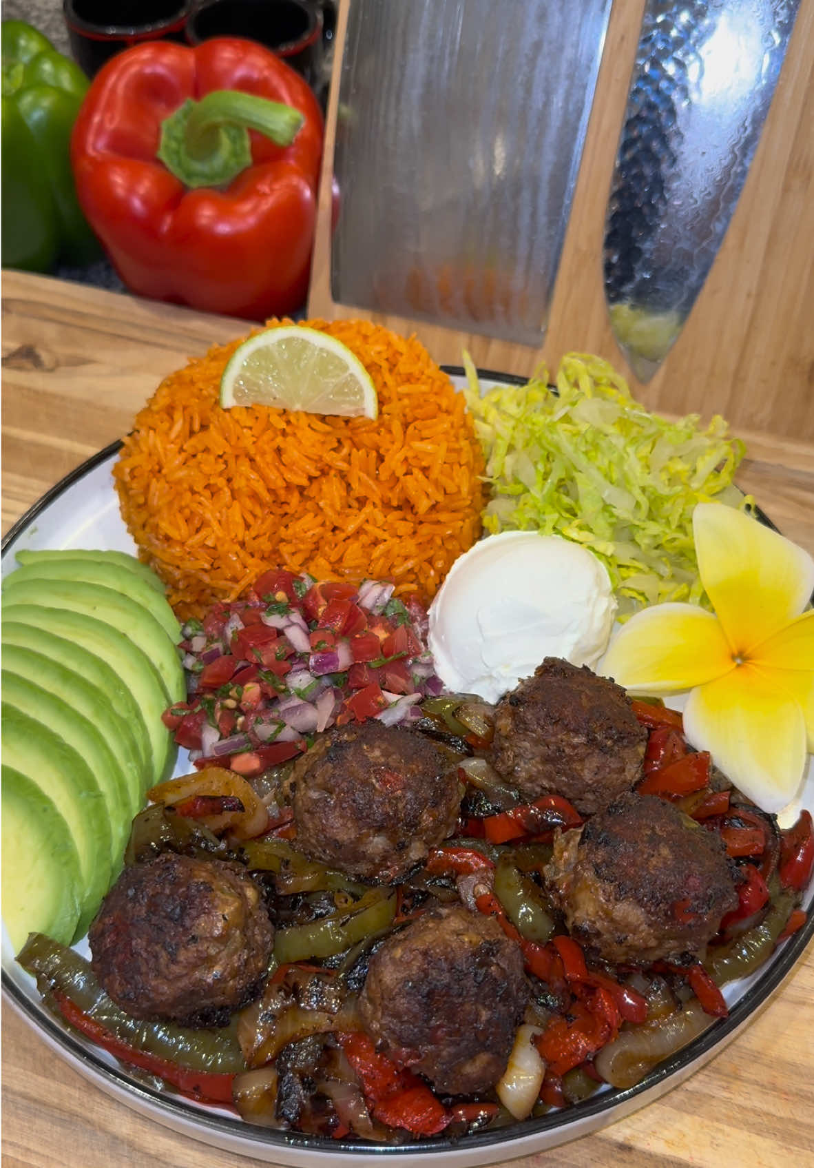 Steak Fajita Meatballs🥩🫑 #Recipe #EasyRecipe #highprotein #lowcarb #mealprep #mealprepideas #dinner  In a large mixing bowl add: -2 bell peppers and 1 small yellow onion (that have been finely diced, charred in a pan, and completely cooled) -1 tablespoon of minced garlic  -2 whisked eggs  -2 pounds of 85/15 ground beef  -3 tablespoons of flour -8 ounces of shredded Monterey Jack cheese  -1 packet of fajita seasoning -beef bouillon powder, and Sazon  (Remember to always make a test meatball to see if you seasoned it enough)  Lightly mx it all together.  Then get about 2 tablespoons worth of the mixture, and roll it into meatballs. Sear these on all sides in the same pan as the veggies (on a little bit below medium heat,) and make sure to add more oil if necessary.  The best part about these is that the cheese crisps on the outside of the meatballs! (If the cheese is still sticking, that means the meatballs aren’t ready to flip.) This will make anywhere from 30 to 40 meatballs. They’re great for meal prep, and can be frozen after cooking!  Today I made a whole fajita platter, but I usually eat these with just an avocado ranch salad and it’s so delicious. Enjoy💜