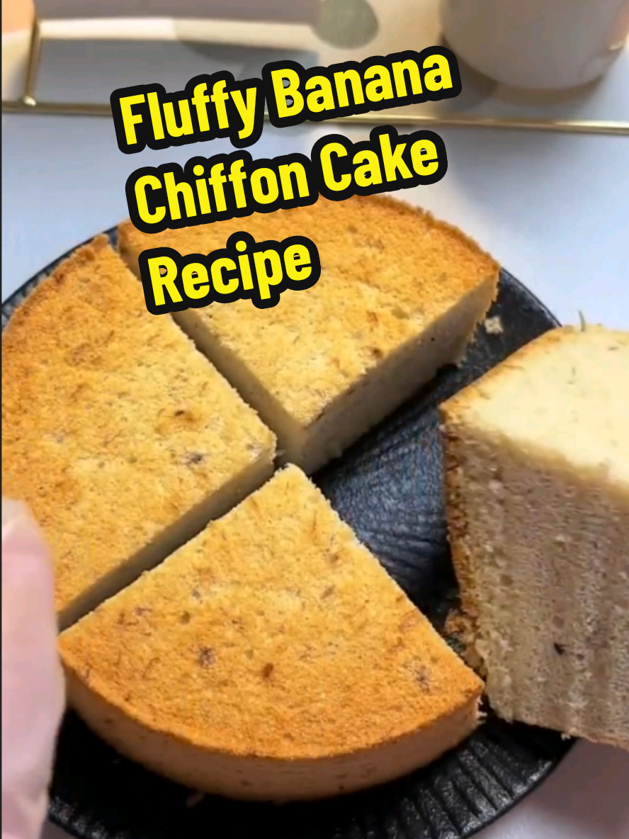 Fluffy Banana Chiffon Cake Recipe  👉Ingredients: Banana Batter: Ripe banana – 100 grams or about one half cup mashed Lemon juice – a small squeeze (about half teaspoon) Vegetable oil – 20 grams or 1 tablespoon plus 1 teaspoon Whole milk – 25 grams or 1 tablespoon plus 2 teaspoons Cake flour – 50 grams or one third cup plus 1 tablespoon, sifted Egg yolks – 3 large Meringue: Egg whites – 3 large Lemon juice – a small splash (about half teaspoon) Granulated sugar – 30 grams or 2 tablespoons plus 1 teaspoon Instructions Step 1: Peel and mash the banana in a bowl until smooth. Add the lemon juice to prevent browning. Step 2: Mix in the vegetable oil and whole milk. Stir until completely blended. Step 3: Sift in the cake flour. Stir in a zigzag motion until there is no dry flour left. Step 4: Add the egg yolks and mix again until smooth and silky. Set this batter aside. Step 5: In a clean bowl, add the egg whites and lemon juice. Use a hand mixer to whip until foamy. Gradually add the sugar in three parts. First when large bubbles appear, second when the texture becomes finer, and third when lines start to form. Whip until soft peaks form with a slight curl at the tip. Step 6: Take one third of the whipped egg whites and gently fold it into the banana batter. Once combined, pour it back into the rest of the meringue. Fold gently until fully mixed. Be careful not to overmix. Step 7: Pour the batter into a six inch chiffon cake pan, filling it about seventy percent full. Smooth the top with a spatula and tap the pan gently to remove air bubbles. Step 8: Bake in a preheated oven. First at 130 degrees Celsius or 266 degrees Fahrenheit for 30 minutes. Then increase to 150 degrees Celsius or 302 degrees Fahrenheit and bake for another 30 minutes. Step 9: After baking, remove the cake and gently tap the pan a few times to release heat. Flip the cake upside down and let it cool completely before unmolding. Enjoy your light and fluffy banana chiffon cake. Each bite is sweet, airy, and filled with natural banana flavor. A soft, fruity chiffon cake that is light as air with the sweet aroma of fresh banana. Perfect for any time of day. #creatorsearchinsights #Recipe #EasyRecipes #cake #baking #fluffy #banana #cooking #nyc 