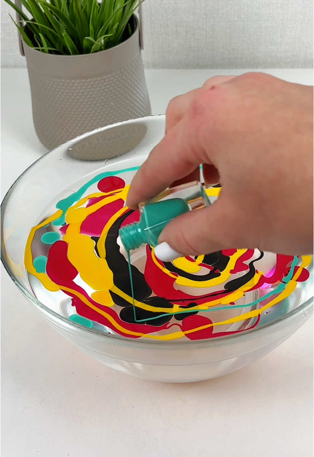 Wow, you won’t believe this can actually be made by yourself! #DIY #ideas #fyp #craft Materials:  • Plate  • Water  • Nail polish  • Bottle caps  • Clasp (or fastener)  • Felt  • Glue  • Scissors  • Pencil