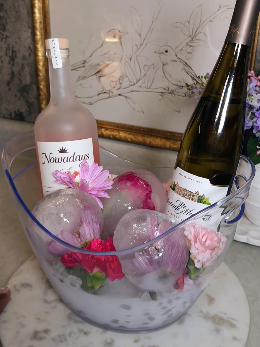 The girls are coming over... ... this is my first time making the viral Floral Ice Spheres and they are gorgeous 😍 the next time I make these, I will try boiling the water or using filter/distilled water to see if the ice comes out clearer. I used real flowers (my flowers from mother's day) If you decide to use faux florals, please keep in mind that they have a dye on them, so I would suggest soaking them to get that initial dye off so your spheres don't turn colors (UNLESS thats the look you want 🙌🏾🥰) When filling the ballons with water, try to enure theres no air bubbles. Just trust me 🫣 I left my spheres in the freezer for 2 whole days to ensure they were completely frozen throughout. #FloraliceSpheres #IceDecor #SummerDecor #PartyDecor #EventDecor #FlowericeSpheres #DIYDecor #UniqueDecor #TableDecor #FlowerArrangement #iceart 