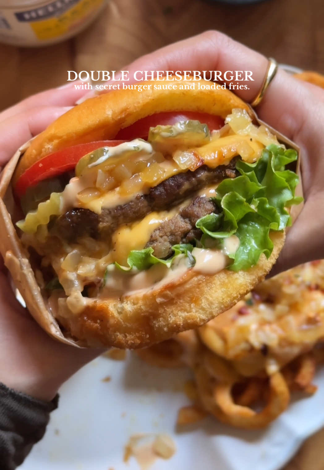 Double Cheese Burger with Loaded Fries Recipe 🍔  Servings: 4-6 Prep Time: 30 minutes Cook Time: 20-25 minutes Ingredients: For the Burgers: - 2 lb minced beef (80/20 lean to fat ratio) - Salt, to taste - 1/2 cup mayonnaise - 1/3 cup yellow mustard - 6 slices cheddar cheese - Oil, for cooking For the Caramelized Onions: - 3 large yellow onions - 4 tbsp butter - Salt, to taste For the Secret Sauce: - 1 cup mayonnaise - 4 tbsp ketchup - 1 tbsp mustard - 1 tbsp Worcestershire sauce - 1 tsp vinegar - 3 tbsp sweet relish - 3 tbsp caramelized onions - Salt, to taste - 1 tsp black pepper To Assemble the Burger: - 6 buns - 6 American/Cheddar cheese slices - 2 large tomatoes, thinly sliced - Homemade secret sauce - Caramelized onions - Pickles - Lettuce For the Fries: - 30 oz frozen French fries - 1/3 cup secret sauce - 1/3 cup caramelized onions - 4-5 slices American/Cheddar cheese Instructions: 1. Caramelize onions in butter until golden brown season with salt. 2. Mix mayonnaise into minced beef. Add mustard season with salt and pepper. Form into patties and cook in a pan with oil until cooked to desired doneness. 3. Make secret sauce by combining ingredients in a bowl. 4. Assemble burgers with toasted buns, cheese, lettuce, tomato, caramelized onion, and secret sauce. 5. Cook French fries until golden brown. Top with secret sauce, caramelized onions, and cheese. Enjoy your delicious double cheese burger and loaded fries! #Recipe #cheeseburger #doublecheeseburger #burgerwithfries #Recipe 