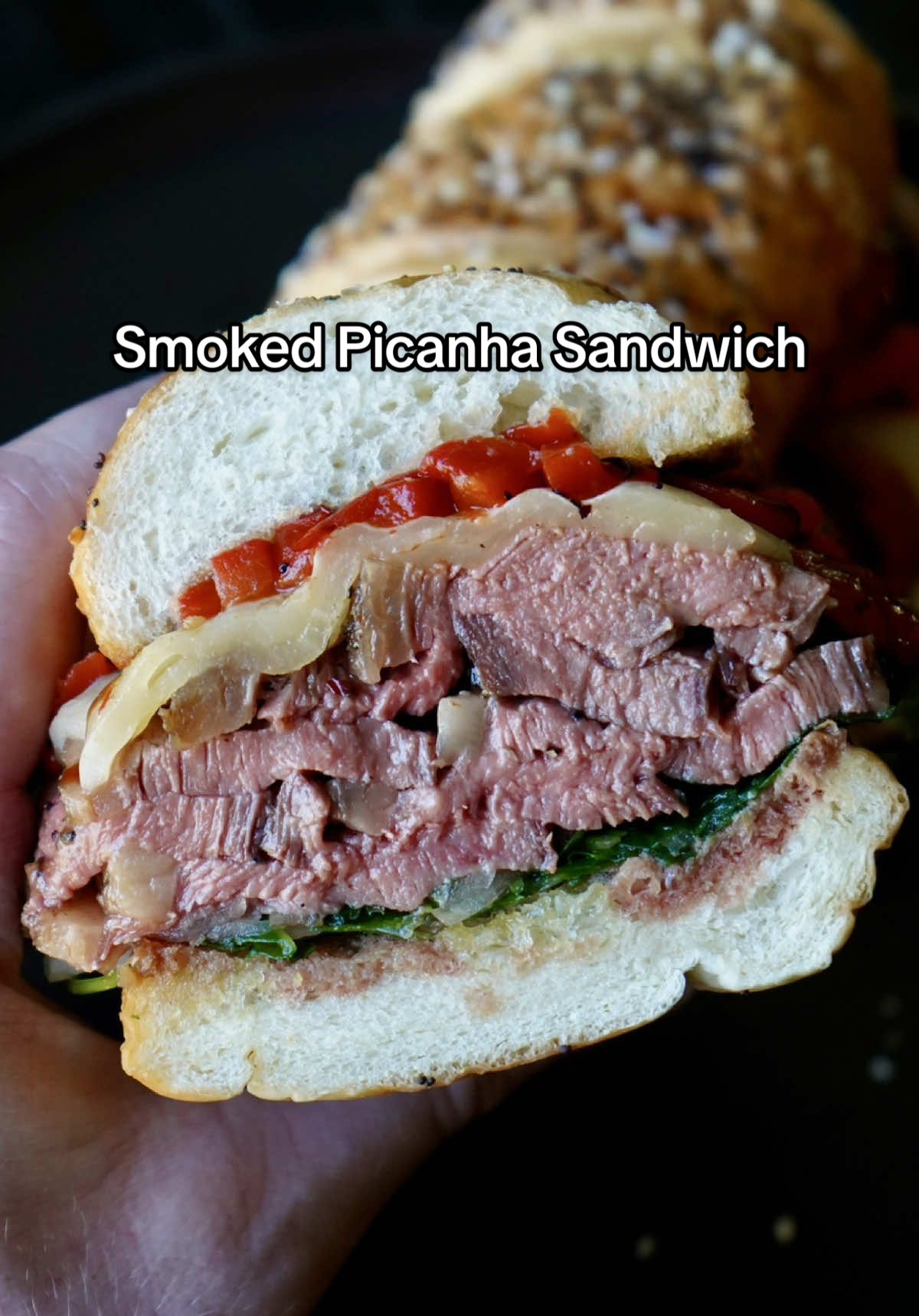 Smoked Picanha Sandwich 🥩🔥 Simply put, this right here was one of the BEST damn sandwiches I've ever had. If you want want to experience an insane combination of flavors, give this one a try!  FULL RECIPE ⬇️ INGREDIENTS  - Everything baguette  - ~2 lb Picanha from Colorado Craft Beef (Link + discount code in bio) - Extra virgin olive oil - Redmond's Organic Garlic Pepper  - Arugula  - Thinnly sliced onions  - Truff truffle oil  - Salt & pepper  - Provolone cheese  - Roasted red peppers - Balsamic glaze  Note(s): Measurements are estimated, adjust ingredients to your liking.  DIRECTIONS  1. Pat the picanha dry with paper towels then coat in olive oil and season heavy on all sides with the Garlic Pepper Rub.  2. Smoke it at 275° until it reaches around 115° internal then pull it off, crank up the heat and sear it over high heat for a few minutes per side until it reaches ~130° internal. Once done, let it rest for ~15 minutes before slicing.  3. In a bowl, combine arugula, onions, drizzle of truffle oil, a pinch of salt & pepper. 4. Toast the bread. 5. Assemble your sandwich & ENJOY! 🙌🏻 • • • • #explore #cooking #bhfyp #food #EasyRecipe #simple #foodporn #healthy #tasty #healthyrecipes #beef #calwillcookit #diet #healthylifestyle #sandwhich #gains #steak #highprotein #grilling 