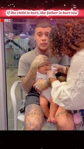 Father hurts when his child is hurt #fyp #viral #emotional #reaction #foryou #baby #dad #piercing #child 
