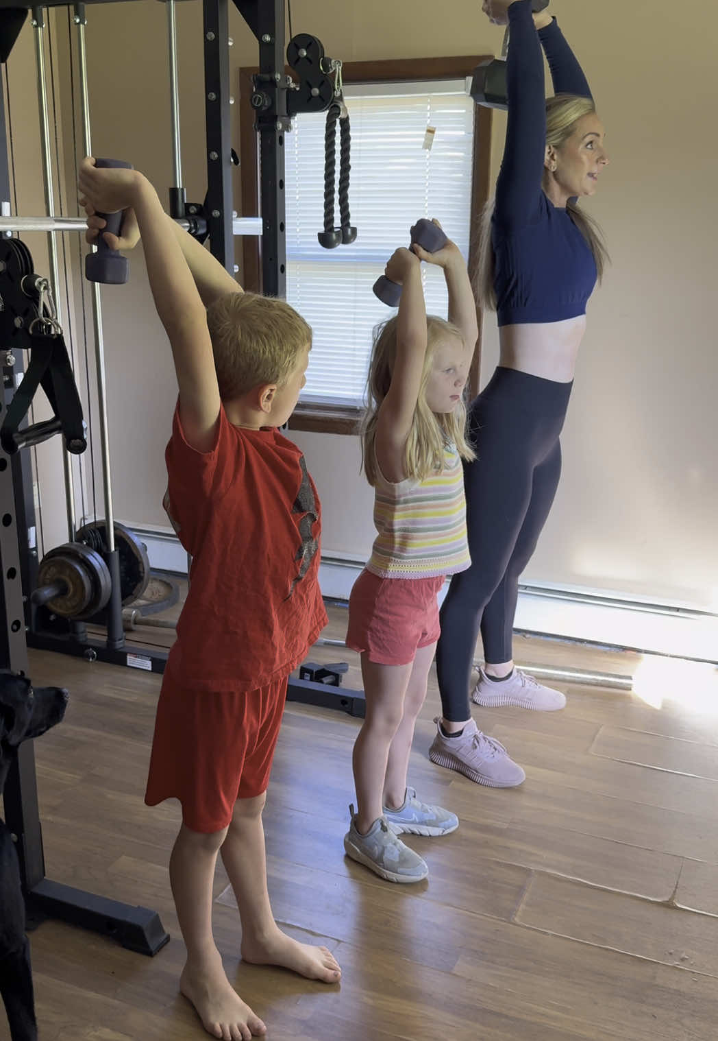 Another day off of school means another lesson in the gym 💪🏻 #momlife #momswholift #weightlifting #healthyhabits #activekids #kidsfitness #momtok #triceps #athomeworkout 