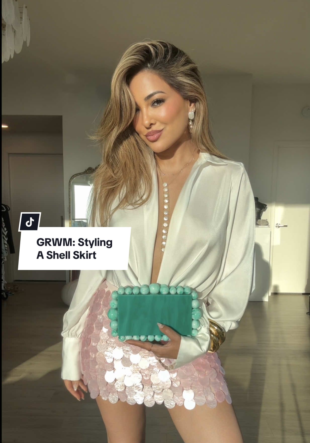 GRWM: Styling A Shell Skirt💫 #fyp #styleinspo  Rate this #OOTD from 1-10 ✨ Today’s Affirmation: “I embrace new opportunities as they come”🤍 p.s some of the shells fell off, but I stitched them back on after filming lol! TAG someone who would love this & don’t forget to save the video to refer back to when styling • #outfitinspo #fashion #styletips #outfitideas #grwm #fashionstyle #styling #todaysoutfit #todayslook #foryourpage #fashiontiktok  Outfit Details: top — showpo  skirt — whitefoxboutique  earrings — ettika  cuffs — alexisbittar  shoes — schutz  perfume — kilianparis  body oil — soldejaneiro  bag — amazonfashion  body + hand-chain — begoldish