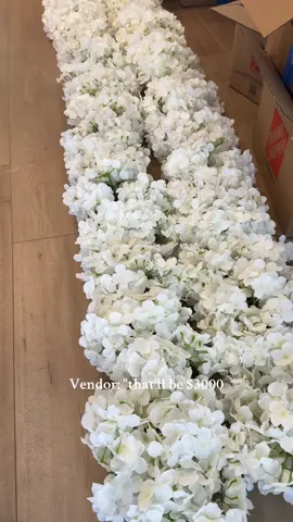 My aisle garlands are almost done! So happy with this budget DIY.  #weddingdiy #diyweddingdecor #flowergarland #silkflowers #diybride 