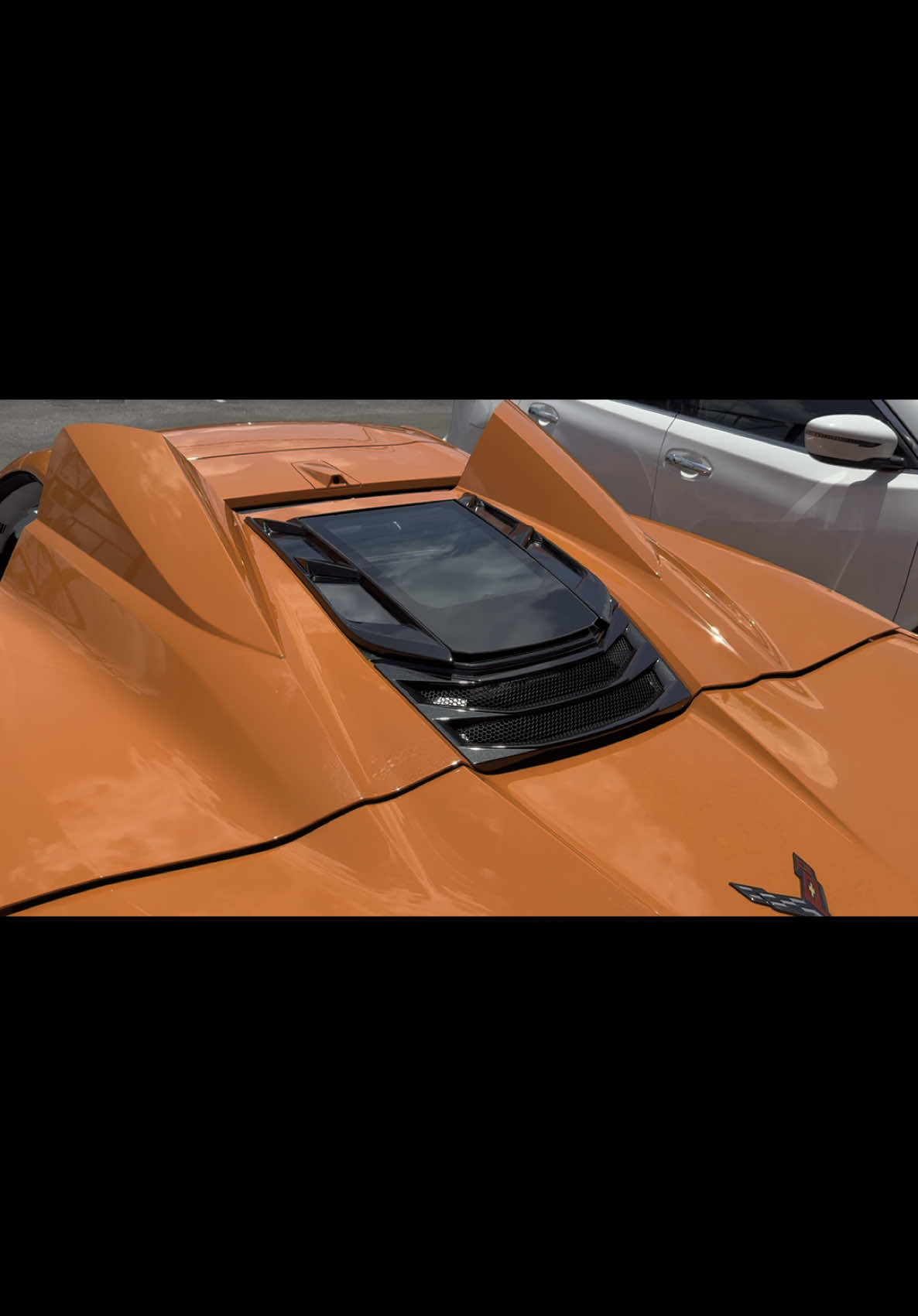 Installing a Falcon Design engine window, carbon fiber lower engine cover, and carbon fiber intake covers on a C8 Corvette Z06 convertible (HTC) at The Shop in Bradenton, Florida. 