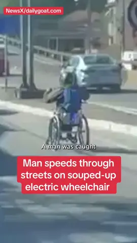 Man speeds through traffic on electric scooter