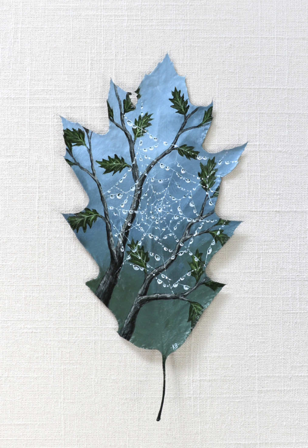 “Rain Weaver” Painted on a preserved red oak leaf 🌧️ Our first summer here, an orb weaver made her home among the string lights in our backyard. It was amazing how quickly she could build those intricate webs! And after rain, they looked a bit like pearl necklaces. I can’t help but think she should be considered an artist, too. 🕸️ #natureart #rainart #stormart #leafpainting #preservedleaf #natureartist 