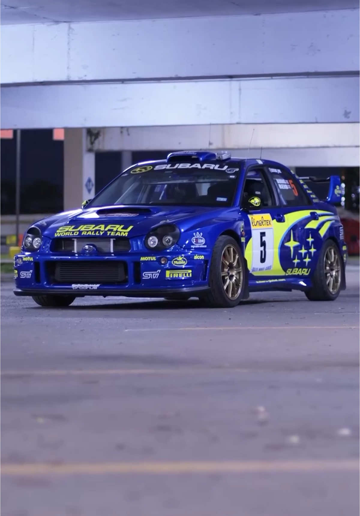 The “Bugeye” Subaru Impreza WRX (2001–2002) is one of those love-it-or-hate-it designs — but in rally form? It’s undeniable. The nickname comes from those distinctive round headlights, inspired by classic rally cars from the past and built with function in mind: better visibility in poor conditions, just like Subaru’s WRC cars. Under the hood: a turbocharged 2.0L EJ205 flat-four (boxer engine), pushing around 227 hp through Subaru’s symmetrical AWD system. Paired with a 5-speed manual, it was raw, responsive, and purpose-built — especially in WRX trim. Built off lessons from the World Rally Championship, the chassis was reinforced, the suspension was rally-tuned, and the drivetrain delivered torque to all four wheels with relentless grip. The Bugeye wasn’t just a street car with rally decals — it was a rally car you could drive to work. Its quirky looks? Now iconic. Its performance? Still capable. The Bugeye WRX is peak early-2000s Subaru — functional, fearless, and unforgettable. Follow @thearchivecoop for more legends that left tire marks on history. 🎥 @df_filmsbyeli  #SubaruWRX #BugeyeWRX #SubieLife #WRCInspired #BoxerEngine #AWDMonster #FlatFourPower #JDMIcons #RallyLegends #CarReelsDaily #BoostedCars #ManualOnly #sti #WRCThrowback #RallyHeritage #CarCultureReels #TurboLife #DrivenNotGarageQueen #GravelMachine #ReelsThatMove #AWDLife #Subaru #PetrolheadParadise #IconicDesigns #CarVibesOnly #Early2000sCars #TrackToStreet #SubaruLove #MotorsportDNA