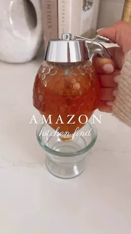 Amazon Kitchen Find✨ This honey dispenser is the perfect way to store your honey. No more messy sticky jars and best part it looks cute on your counter too! 🍯🤍 Link to shop in bio🤍@Amazon Home #kitchenfind #amazonhomefinds #kitchengadgets 
