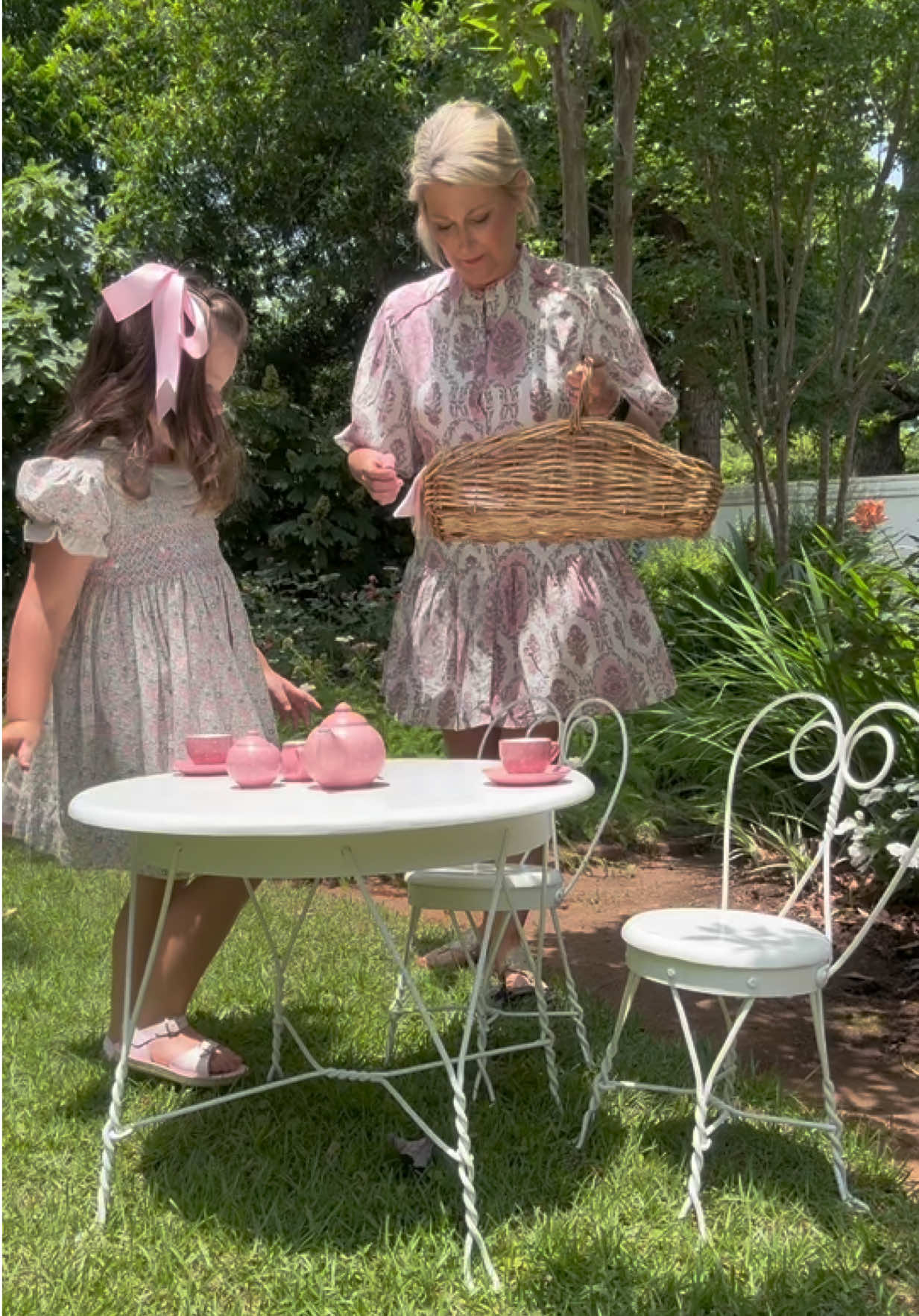 Lilac and Pink were the colors of the day for our tea party in Yaya’s yard. No detail was left out from the wrought iron table and chairs that belonged to us girls when we were younger or the beautiful print dresses that matched our linens and tea set. Take the time to add the little details they will not be forgotten. Check out this beautiful dress from @Shopfoxandhen it is perfect for many occasions not just a tea party code Kasey15. #capcut #tea #teaparty #blockprint #pink #may #teatime  @cecilandlou 