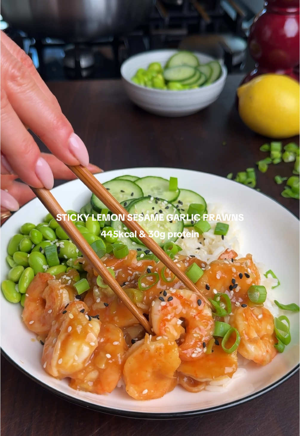 STICKY LEMON SESAME GARLIC PRAWNS One of my favourite Chinese takeaway dishes is lemon chicken but this lighter, zippier prawn version hits all the right notes. Juicy prawns tossed in a sticky citrus sauce with lots of ginger, garlic and soy. Served with rice, edamame and crunchy cucumber for freshness. So simple, speedy and seriously delicious. To serve 2 445 kcal & 30g protein 180g raw king prawns 1 tsp cornflour 1/4 tsp white or black pepper Juice of 1 lemon 2 tsp sesame oil 2 tsp honey 1 tbsp light soy sauce 1 tsp cornflour mixed with 50ml water 1 garlic clove, minced 1 heaped tsp ginger paste 2 spring onions, finely sliced Pinch of chilli flakes (optional) 250g cooked rice 1/4 cucumber, thinly sliced 4 tbsp edamame Method Toss the prawns with cornflour, salt and pepper.  Whisk together lemon juice, sesame oil, honey, soy sauce and cornflour slurry to make your sauce. Set aside.  Heat a little oil in a non-stick pan. Fry the prawns for 1–2 minutes on each side until pink and crisp. Remove and set aside. In the same pan, sauté spring onions, garlic and ginger for 1–2 minutes until fragrant. Add a splash of water to deglaze the pan to get all the nice prawn flavour bits. Pour in the sauce and simmer until thickened and glossy. Loosen with extra water if it goes too thick. Return the prawns to the pan and toss them through the sauce until well coated.  Serve over rice with cucumber and edamame. Finish with more spring onion or sesame seeds if you like. #healthyrecipes #highprotein #EasyRecipe 