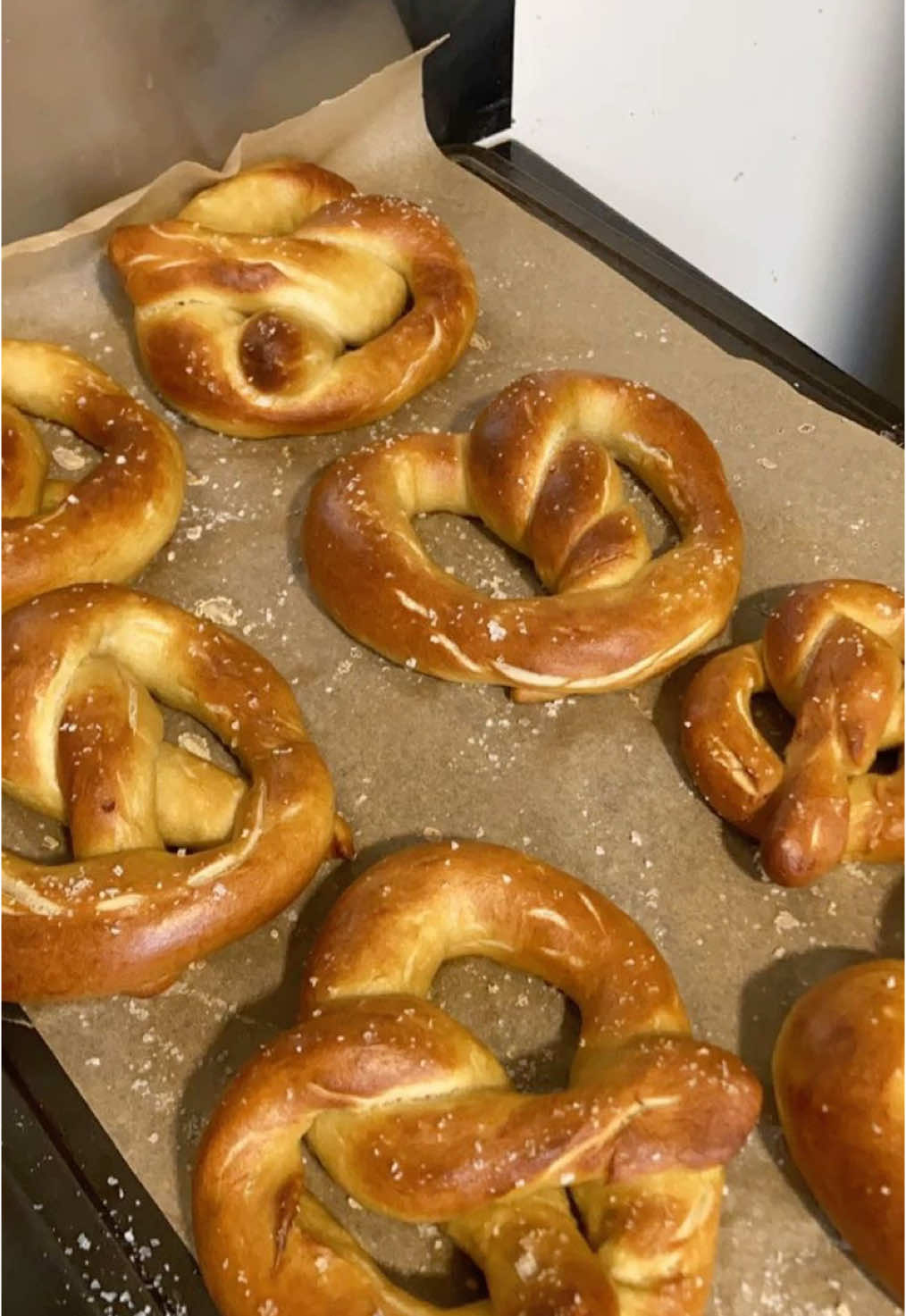 🥨 HomemadePretzels 🥨 1 & 1/2 cups warm water 2 tsp honey 2 tsp kosher salt 2 & 1/4 tsp active dry yeast 4 & 1/2 cups all-purpose flour 4 tbsp unsalted butter  2/3 cup baking soda 1 large egg yolk beaten with 1 tbsp water Kosher salt for topping (optional) In a large bowl (or bowl of stand mixer) add water, honey, and yeast. Stir and let sit for 5-10 mins until foamy. Combine flour and melted butter. Knead dough for 5-10 minutes (until it is smooth). Transfer dough back to bowl, cover, and let rise for 1 hour. Preheat oven to 450°F. In a large pot over medium-high heat, whisk together baking soda and 10 cups of water. Bring mixture to a boil. While water is starting to boil, divide dough into 10 pieces. Roll out each dough piece into 24 inch ropes. Shape ropes into pretzels. Place pretzels into boiling water for 30 secs. Remove from water and transfer to prepared pan. Brush pretzels with egg wash and sprinkle with salt. Bake for 12-14 minutes. That’s it!  #homemade #fromscratch #pretzel #Recipe #EasyRecipe #simple #simplelife #simpleliving #simplerecipe #baking #oldfashioned #selfsufficient #snack #homestead #homemaking 
