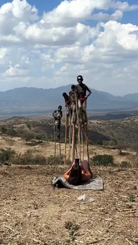 BANA tribe 🤸🏻‍♂️ Ethiopia 🇪🇹 It is one of the most interesting tribes in Omo valley and also my favorite ❤️  What makes them very different from the other tribes in the area is the ability of small boys to walk on the sticks…How cool is that?! They learn this to be able to see their cattles in the bush much easier and also to be able to walk on harsh terrain 🏔️ Would you trust them walking above you? 😅 #omovalley #ethiopia #tribes #visitethiopia 