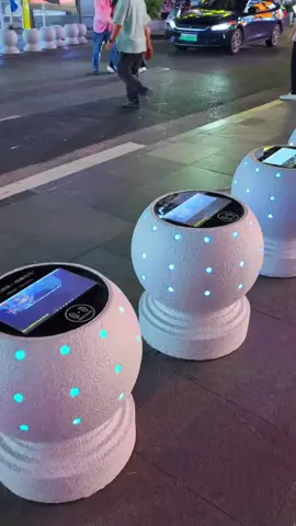 These street bollards in Shenzhen, Guangdong Province have been transformed into free wireless charging stations, with screens for watching videos. Tech and convenience, right on the sidewalk. #ChinaTech #technology #china #viraltiktok