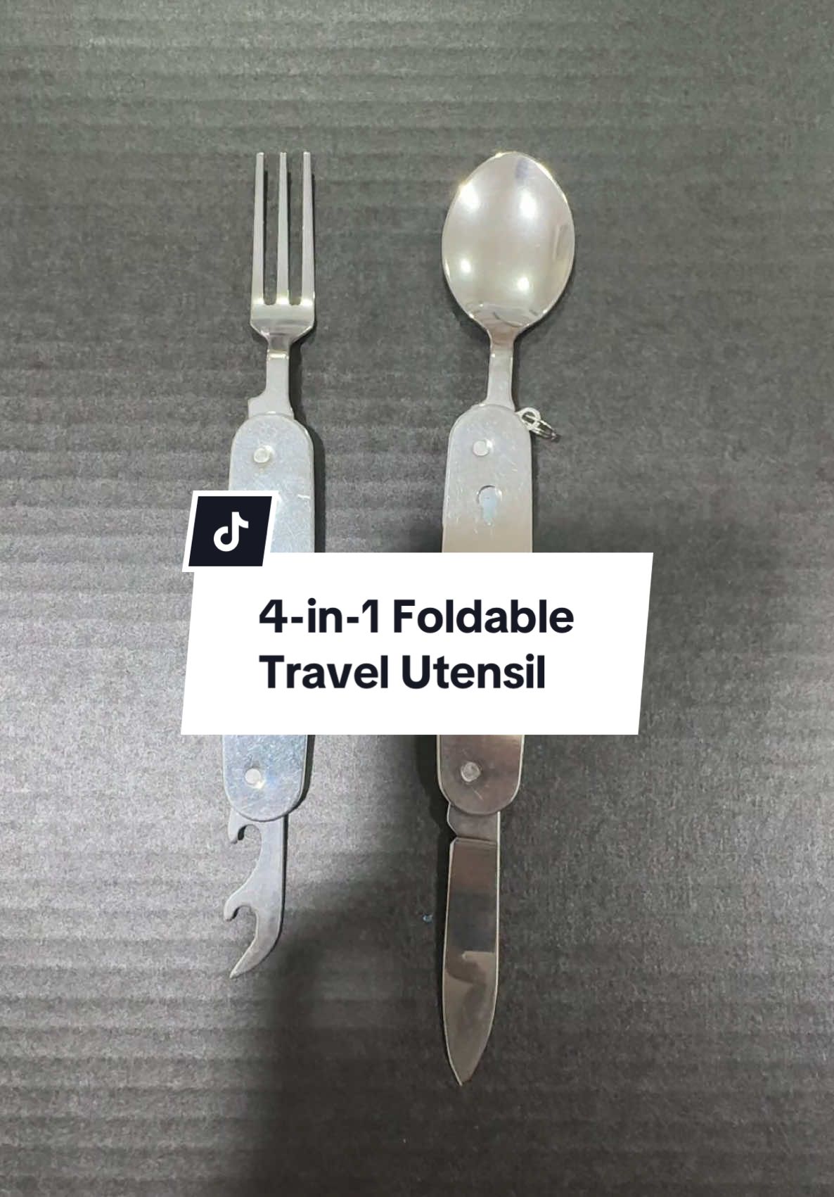 This tiny gadget is actually a 4-in-1 lifesaver—spoon, fork, knife, and even a bottle opener. And yes, you can use the spoon and fork at the same time. Travel Friendly ✔️ #4in1Utensil #CampingHack #TravelEssential #GadgetTikTok #foldablespoonfork #travel #TravelEssential #fyp #traveltips 