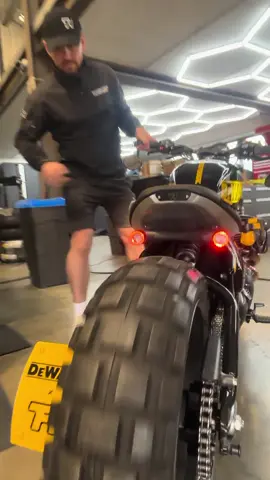 GUARANTEED TOUGH. Unveiling our latest partnership Bobber build, crafted exclusively for @dewalttoolsuk. This Adventure Bobber showcases a fully bespoke DEWALT-inspired design, with custom paint and a matching seat, meticulously upholstered using materials from their iconic tool bag range, along with custom DEWALT 3d printed mounting points and DCL182 light mounts in place of our PIAA Lights #thorntonhundredmotorcycles #thorntonhundred #bobber #bespoke #motorcycle #triumph #partnership #GUARANTEEDTOUGH