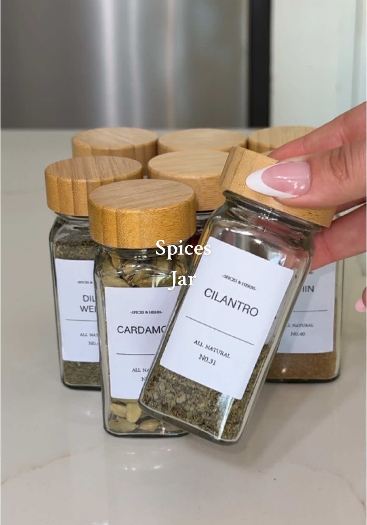 These spice jars just upgraded my entire kitchen 🫶✨ There’s something so satisfying about matching labels and clean countertops. Who else is obsessed with restocking videos? #spices #spicedrawer #organizedhome #restocking #restock #satisfying #motivation #homeproject #KitchenHacks #kitchen #organized 