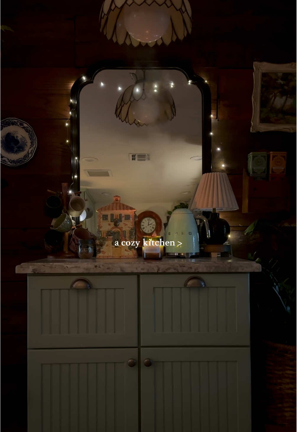 Our cozy kitchen. ✨  This house feels alive. I say hello and goodbye to it when I come and go. This house is warm and safe and happy. I just love being here in my little fairytale space—especially in my kitchen.  Fun fact: the cabinets, countertops, the sink were once in my childhood kitchen. I coveted the kitchen in the house I grew up in, and when my parents remodeled, they offered all their old materials to us—there is so much sentimental value in this space that truly can never be replaced.  #antiquestyle #cozyathome #cottagestyle #cottagekitchen #cozykitchen #whimsigoth #fairycore #darkacademia #lightacademia #vintagedecor #hobbitcore #BookTok #darknaturalism #houseplants #darkfantasy #fairytalestyle #fantasystyle 