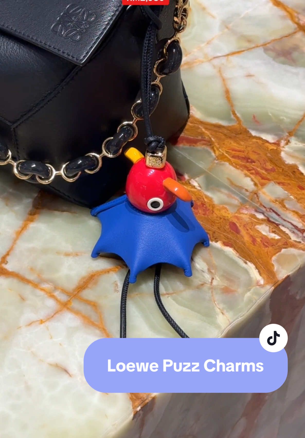 each Puzz charm can be paired w a matching bag to celebrate the 10th anniversary of the Loewe Puzzle bag! 🧩 @LOEWE #loewepuzzlebag #loewepuzzle #loewepuzzle10 #loewepuzzle10thanniversary #loewepuzz #puzzcharm #loewepuzzcharm #loewecharm #loewetok #trx #theexchangetrx #luxurytok #bagcharm #theklccboy #pursebop #fypmalaysia #loewebyjwa #jonathananderson 