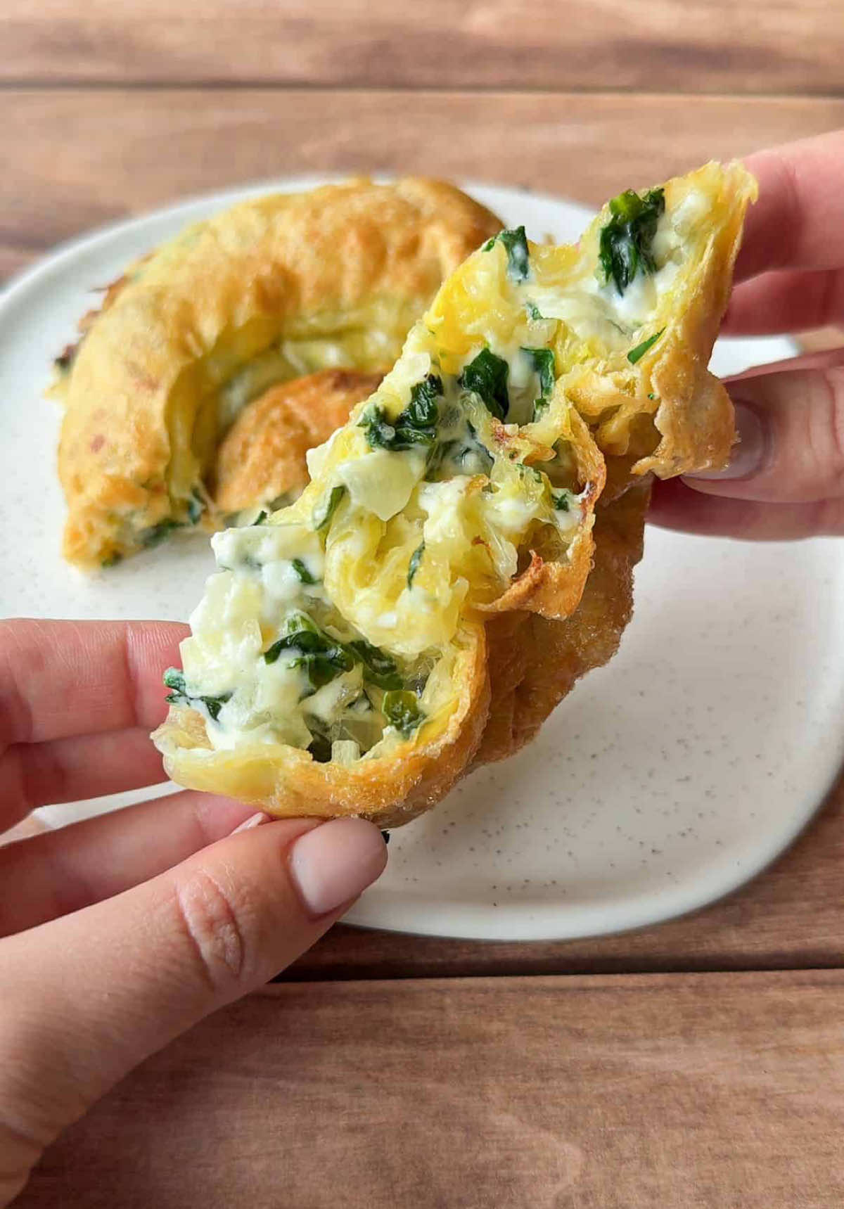 Spanakopita just got a high-protein, low-carb glow-up! 😍 This viral rice paper version is crispy, cheesy, and macro-friendly. Just 387 calories and 34g of protein—Ready in 20 minutes! 🤯  #HighProtein #RicePaper #AirFryerRecipes #Spanakopita https://themodernnonna.com/rice-paper-spanakopita/