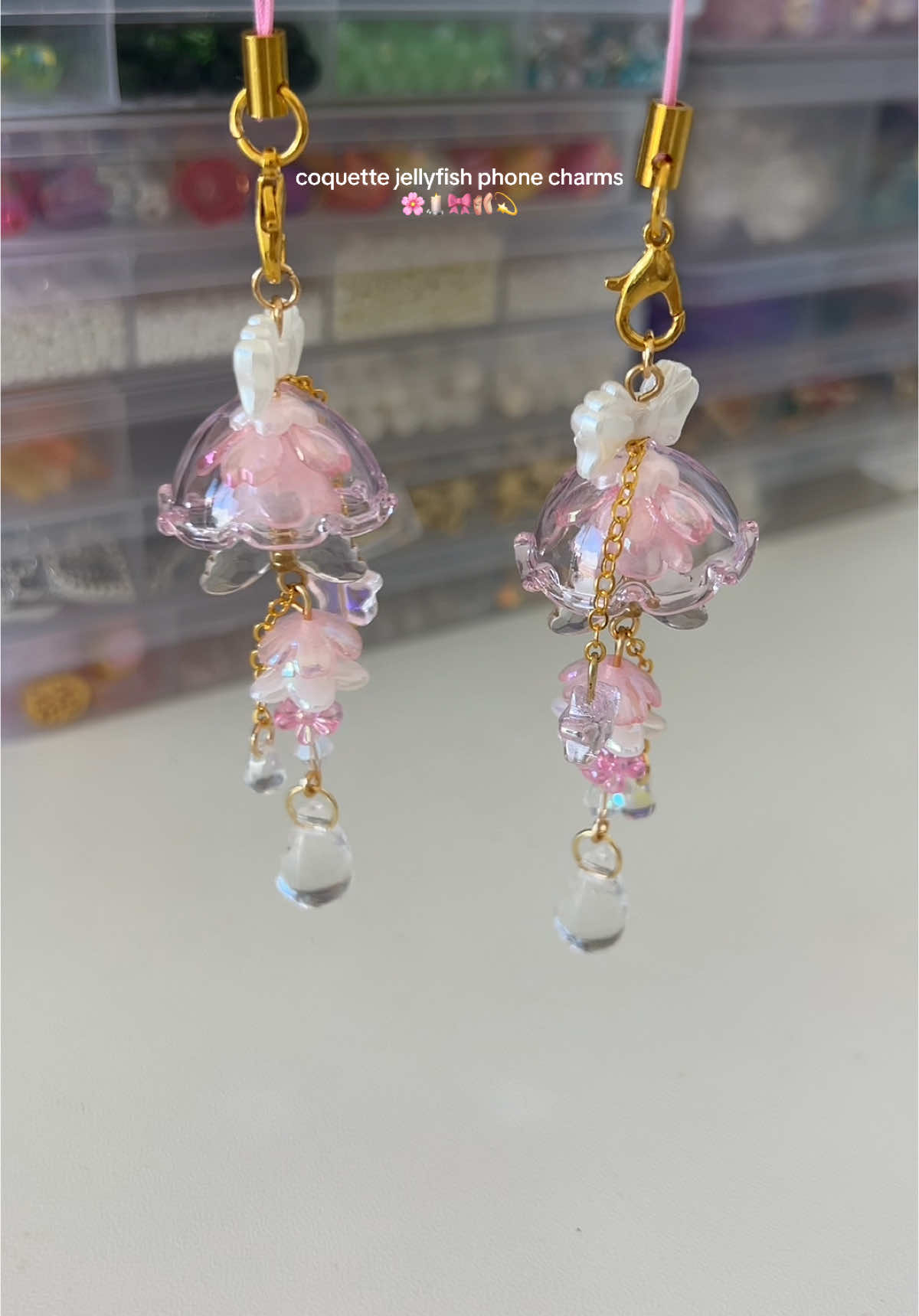 how i make my coquette jellyfish phone charms 🌸🎀🩰 i had this idea in the works for a while before i finally came up with the design, but i couldn’t be happier with how these little jellies turned out! 💫🪼🫧 #coquette #phonecharm #beadedjewelry #jewelrymaking #fyp 
