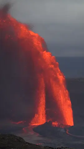 The North Vent emits an enormous lava arch as Kīlauea Volcano erupts during Episode 23 of the ongoing series… on the eve of 25 May 2025. The South Vent was just beginning to fountain at the left around 5:45pm when this video was shot . #kilauea #kilaueavolcano #kilaueaeruption #volcano #volcanoes #volcanoerupting #hawaii 