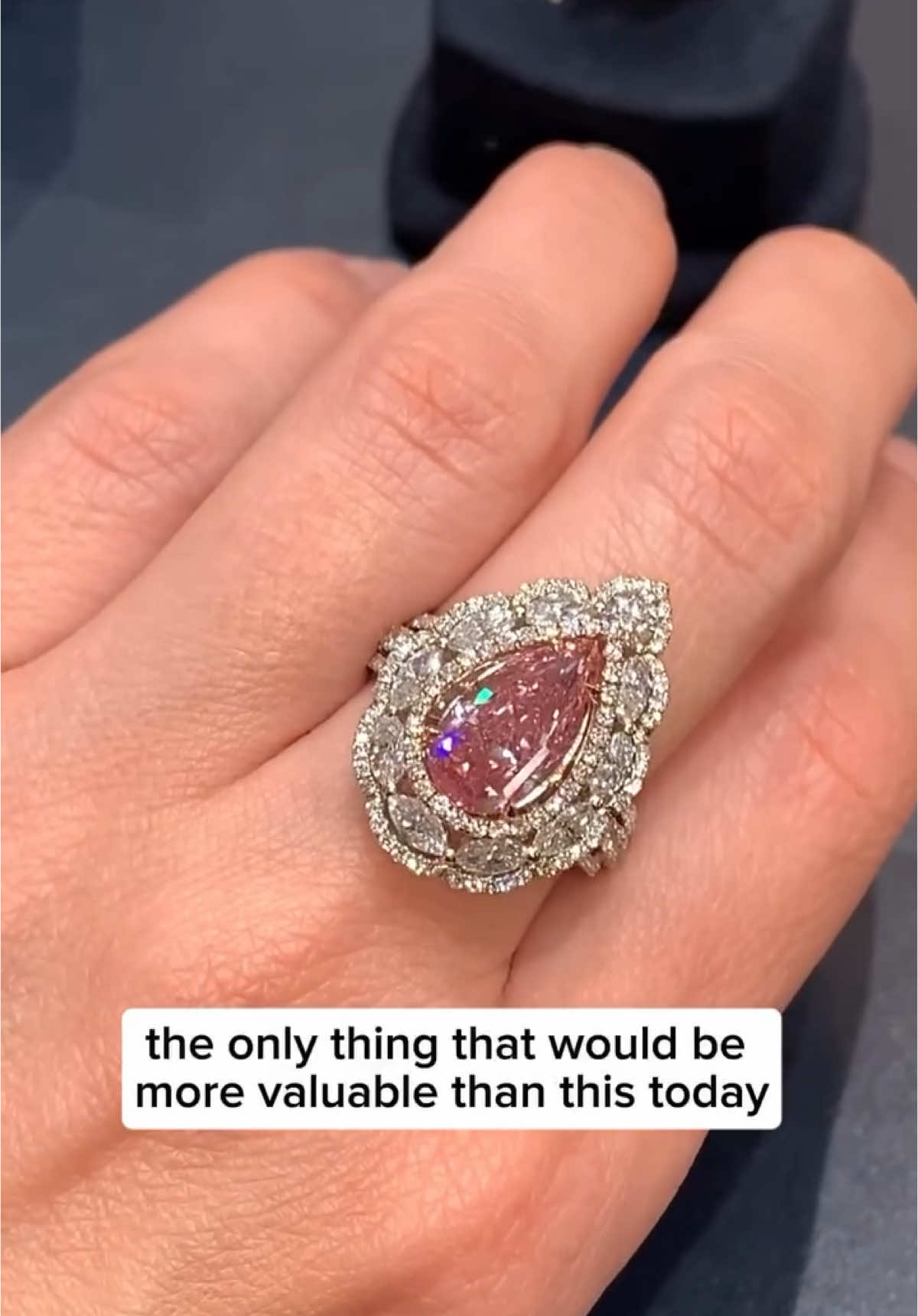 This extraordinary 3.02-carat Fancy Vivid Pink diamond represents the pinnacle of gemological rarity, ranking among the most coveted stones in existence. The pear-shaped diamond exhibits exceptional VS2 clarity—remarkable for a pink diamond of this caliber—with an even color distribution that showcases its vibrant pink hue to perfection. Enhanced by 2.45 carats of meticulously placed accent diamonds in a sophisticated platinum and 18K gold setting, this ring exemplifies both gemological excellence and refined design artistry. 📽️ Courtesy: Ms Rau jewels #BeInspiredByTheDolceVita ✨ #luxurylifestyle #WoWMe  #ImAFan 