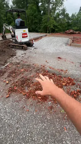 Grading out a slab after the plumbers #concrete #construction #operator #heavyequipment 