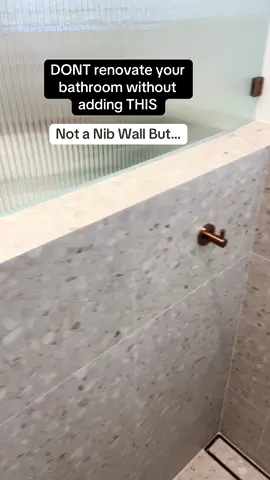 Looking for an easy to clean bathroom design hack, you have come to the right video! The T wall will be the most popular bathroom shelf in 2026 because it both serves as something that is easy to clean and eliminates hard to reach gaps  Our twist on this trending design is the secret hidden niche which acts as a place to put all your bottles out of the sight of everyone as well as a foot rest. It will make your bathroom special.  If you would like to know the sizing needed to create this just comment “size” #builder #renovations #remodel #interiordesign 