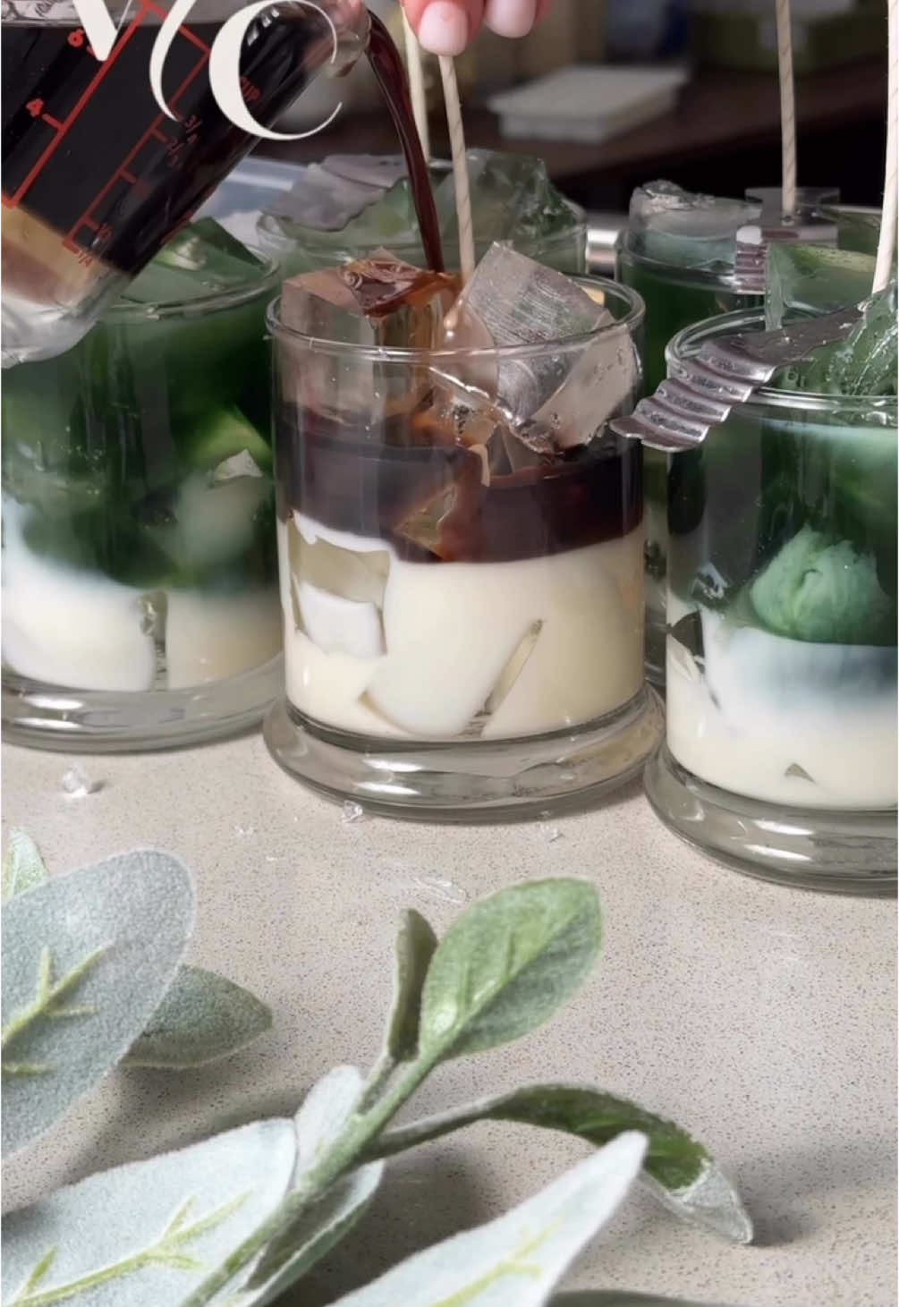 Iced Matcha Latte vs Iced Coffee Latte. What would be your preference? ☕️🍵🧊#candleart #matchacandle #coffeecandle #candlemaking #asmrreels #soycandles #satisfyingmoments #VelvetCandleCo #gelwax 
