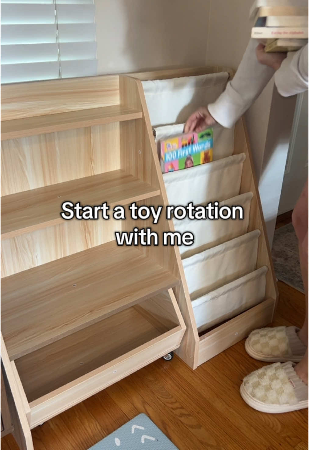 Love this cute kids shelf for my toddler to have a toy rotation. I want to keep books handy so the fact this kids shelf is half book shelf and half toy shelf is great… plus the bottom wheeling drawer for all the tiny toy pieces! #toyshelf #toystorage #toystoragehacks #toyrotation #toddlertoyshelf #toddlertoystorage #toddlermom #toddlermomlife 