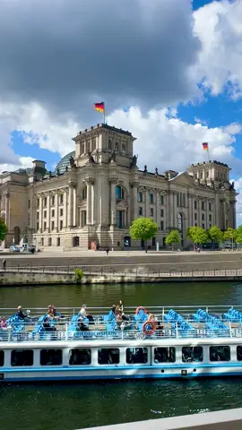 A stunning view of the Reichstag building, complemented by the graceful passage of ferries along the river.  #berlin #germany #adventure #travel #beautifuldestinations #travelphotography #europe #adventure 