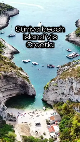 Stiniva beach island Vis Croatia (description in Croatian & English) Stiniva je jedna od najpoznatijih i najljepših plaža na otoku Visu, smještena na južnoj obali otoka, u skrovitoj uvali okruženoj visokim stijenama. Do plaže se može doći brodom, što je najčešći i najlakši način, ili pješke strmom stazom koja vodi nizbrdo s obližnje ceste, što zahtijeva dobru obuću i određeni fizički napor. Uvala je uska pri ulazu, s dvije visoke stijene koje je štite od pogleda i vjetra, a zatim se širi u mali šljunčani zaljev s kristalno čistim morem. Zbog prirodnog oblika i impresivnog pejzaža, plaža Stiniva je 2016. godine proglašena najljepšom plažom u Europi prema izboru jednog turističkog portala. Plaža je bez većih sadržaja, što doprinosi njezinom prirodnom i mirnom ugođaju, a u blizini se nalazi mali ugostiteljski objekt u kojem se može popiti piće ili pojesti nešto jednostavno. Idealna je za one koji traže autentično i netaknuto mjesto za kupanje i uživanje u prirodi, daleko od urbanih gužvi. Stiniva is one of the most famous and beautiful beaches on the island of Vis, located on the southern coast of the island in a secluded cove surrounded by high cliffs. The beach is most easily accessed by boat, which is the most common option, although it’s also possible to reach it on foot via a steep downhill trail from a nearby road—this route requires proper footwear and a bit of physical effort. The cove is narrow at the entrance, flanked by two tall cliffs that shield it from view and wind, and it then opens into a small pebbled bay with crystal-clear water. Because of its unique shape and stunning landscape, Stiniva was named the most beautiful beach in Europe in 2016 by a popular travel portal. The beach has minimal infrastructure, which adds to its natural and peaceful atmosphere, though there is a small local bar nearby where you can grab a drink or a simple meal. It's ideal for those seeking an authentic and untouched spot to swim and relax in nature, far from urban crowds. #croatia #bestplaceincroatia #europeantravel #vis #stiniva 