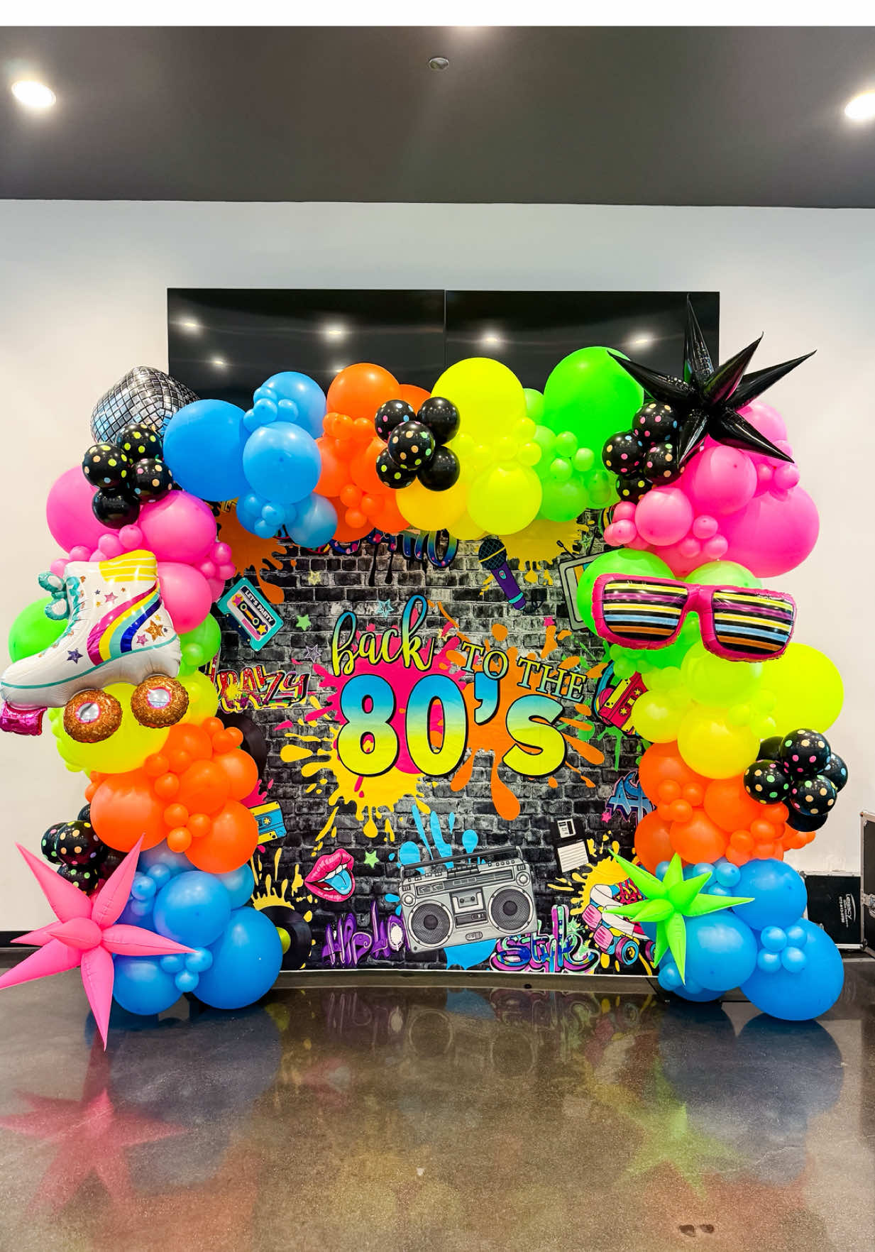 This 80’s balloon setup brought the funk, flair, and full-on flashback! 🎶🛼 Neon? ✅ Boomboxes? ✅ Disco balls and roller skates? ✅ 🎈Follow for more balloon inspo, tips, and tutorials. Shop my Amazon shop in link in bio.  #joyfullballoonboutique #backtothe80s #80svibes #balloonbackdrop #balloonsetup #balloons #balloondecor #partyballoons #balloongarland #ballooncolumns #ballooninspo #balloonbusiness #customballoons #balloonartist #eventsetup 