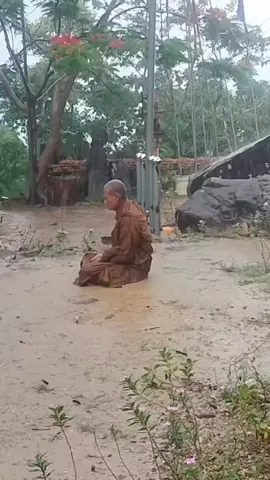 Buddhist monk is practicing meditation during heavy raining ☔️ 