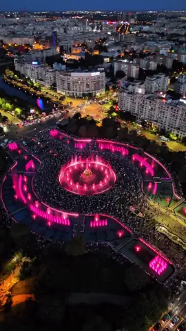 What’s the last thing that made your jaw drop? In the throbbing heart of Bucharest, where concrete veins split the city into stubborn halves, the Unirii Fountains throw water like poetry flung into the sky. They don’t whisper—they roar in color, in rhythm, in defiance of the ordinary. Just when you think the city has shown you all its cards, this boulevard unravels a spectacle so precise, so outrageously unnecessary, it makes you believe again in beauty for beauty’s sake. Stretching longer than a fever dream and flanked by the austere immensity of the House of the People—the world’s heaviest building, a paradox in limestone—the fountains erupt with the subtlety of an orchestra on fire. They’re not trying to be subtle. 44 fountains, 4,500 nozzles, all pulsing to music that slinks from folklore to EDM, casting shadows of color across faces too tired from the week to care—until they do. Here, water dances not like ballerinas, but like rebels: fierce, choreographed chaos framed by one of the most misunderstood cityscapes in Europe. It’s not kitsch. It’s a fevered love letter to the idea that cities can still surprise us. There’s a strange serenity in the synesthesia of it all. Lights slice through vapor like brushstrokes across the night, and somewhere between a gasp and a laugh, you forget what time means. Why does this exist? Who thought to turn a grimy intersection into a cathedral of movement and sound? In a world quick to apologize for grandeur, this place does not. And that’s the charm. What’s the last thing that made you stop and feel something? When did a city last seduce you with water and light? Video by @travel.on.repeat  [Unirii Fountains, House Of The People, Bucharest Landmarks, Nighttime Spectacle, Water Light Shows, Urban Beauty, City Pulse, Choreographed Fountains, Multimedia Architecture, Unexpected Art, Central Bucharest, Street Life, Cultural Core, Romania’s Heartbeat, Light Installation, Civic Pride, Public Art, Visual Symphony, Modern Romania, Tourist Experience] #romania #travel #bucharest #fountainshow 