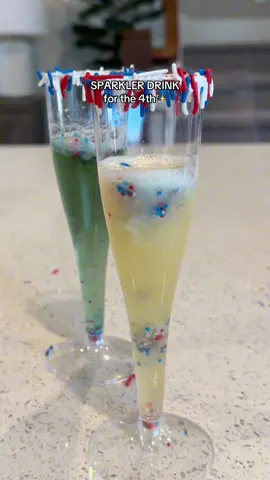 Sparkler cider for kids on the 4th🎇✨ This is a fun way to include your kids on the 4th of july! They’ll love to see the sprinkles in the cider❤️ • WHAT YOU NEED: * cotton candy * Nonpareils sprinkles * Apple cider * Plastic champagne flutes * Marshmallow creme * Toothpicks/skewers DIRECTIONS: 1. Rim the cup with marshmallow creme then roll in sprinkles and set aside. 2. Take cotton candy and pour nonpareils sprinkles inside and close it up to make a ball. 3. Stick a skewer through and place on top of the cups until ready to serve. 4. When ready, have your kids drop the cotton candy ball inside the glass and watch the sprinkles react to the fizz! • • #4thofjuly #kidsactivities #momof2 #drinkrecipe #kidsdrinks #summerdrinks #partyideas 