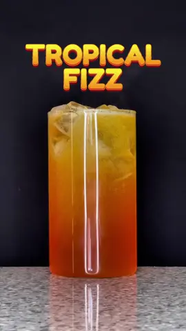 Bringing the vibes with this Tropical Fizz cocktail 🍍 Perfect for making cocktails that pop - passoa, pineapple vodka with a splash of pineapple soda for that ultimate refreshing hit 🧡 #cocktailrecipe #drinks #cocktail #drinkideas 