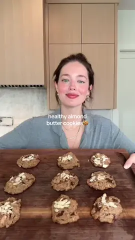 My wedding vow cookies🍪 Healthy almond butter cookies🌙  I’ve been making these for my husband since the start of our relationship, they are so quick to make, healthy, delicious & comforting.   Ingredients:  1 cup almond butter 1 cup unsweetened coconut flakes/shredded coconut ⅓ cup maple syrup 1 egg 1 bar of dark chocolate, chopped 1 tsp vanilla extract ½ tsp baking soda ½ tsp salt Flaky sea salt Slivered almonds  Directions:  1. Preheat oven to 350F. 2. In a bowl, add all the ingredients except flaky sea salt. Mix together well. 3. On a sheet pan lined with parchment paper, scoop out cookies. It should be about 10. 4. Sprinkle the flaky sea salt on each cookie. Add almonds to the top of each, push down on them a bit so they stay on. 5. Bake cookies for 10-12 minutes. 6. Let cool completely before eating!  Enjoy!