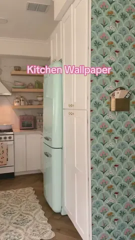 Putting together a whimsical kitchen🌷 Someone asked me to describe my home decor style the other day and the first things that popped out of my mouth were “pink, green, florals, frilly, cutesy”😂 I’m obsessed with how this wallpaper turned out! It’s got a subtle cottage feel to it. I also think it pairs well with the strawberry paper inside the cabinets! #cozyhome #kitchenremodel #kitchendecor #beforeandafter #organizedhome