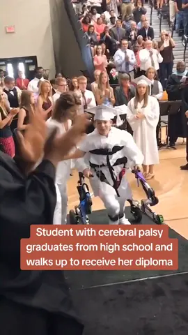 Student with cerebral palsy graduates from high school and walks up to receive her diploma. look at that smile!