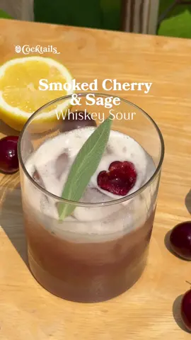 The perfect Father's Day gift to elevate your cocktails, starting with a smoked cherry & sage whiskey sour🥃 Link for the cocktail smoker is in our bio. @cocktails may earn commission through links in our socials Ingredients: - 1 & 1/2 oz. whiskey - 3-4 pitted cherries - 3/4 oz. lemon juice - 1 sage leaf - 1/2 oz. simple syrup - 1 egg white (optional: creates the foamy layer) - cherry flavored woodchips to burn in the cocktail smoker - sage leaf and pitted cherry for garnish #cocktail #smoker #smoked #whiskey #whiskeysour #cherry #sage #FathersDay #gift 