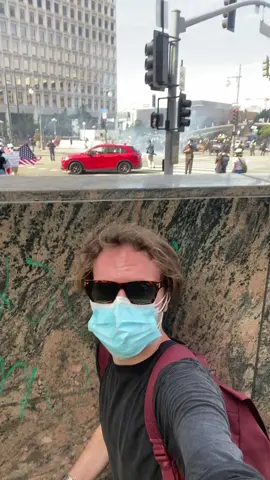 Ducking as tear gas and flash bangs are deployed 