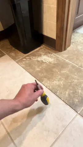 That hollow thunk is the sound of a tile begging to be fixed 😮🔨 #repair #loose #tile #bathroom #homeinspection 