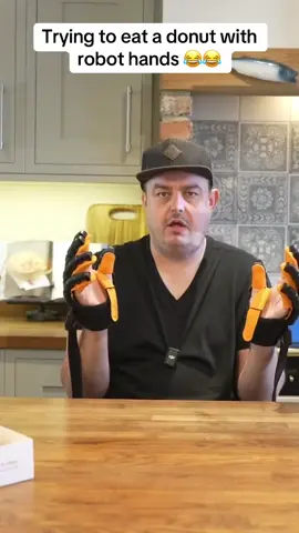 Trying to eat a donut with Robot Hands 😂😂 #daz #comedy #fyp #britishmemes #britishhumour #laughter #viral #offthehook #dazwatches #humour #british #britishcomedy #food #FoodLover #foodies #ai #robot 