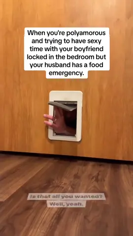Happy one year anniversary to our infamous Cat Door Polyamory video!  Haters will call him a c(u)ck beta soy boy, but really he’s just hungry.  . . . . (As much as this would be way funnier to just leave the short caption as is (since captions are as much of the art as meme/reel making), I already know what the internet will project if I don’t fucking explain the context 🙄 so here’s the context: it was my date night with Dr. M and Joe had been in super adventure dad mode with the kids and got home soooooo late, like, past their bedtimes even! He was managing their tired grumpy hungry chaos alone, and was hungry as fck himself when he discovered my leftovers. Our kitchen table-ness is genuinely chill enough for interruptions like this. No he wasn’t disrespecting my time with Dr. M. No it wasn’t a big deal to ask me for my leftovers. Yes he was being extra with the cat door because he knew it would make me laugh so hard, and it did 😂). . . . ••• If you found this piece of content relatable, educational, or just entertaining…you may really love our free newsletter, our book, our 1-on-1 coaching, the exclusive content on our Patre•n, and our slew of great workshops and courses!  Check out our new children’s book: bit.ly/AMFAB #polyamory 